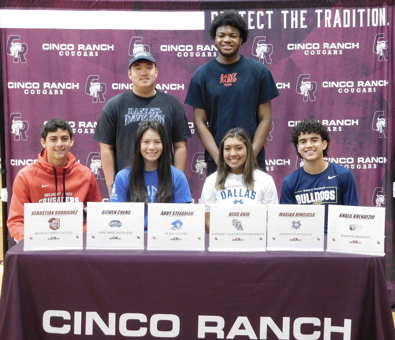 Cinco Ranch student athletes pose for a photo during National Signing Day.